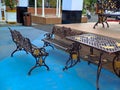 brown gold iron carving bench with arabic architecture in madiun indonesia park, sunny weather