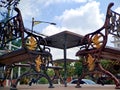 brown gold iron carving bench with arabic architecture in madiun indonesia park, sunny weather