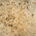 Brown granite texture. Natural rough untreated and unpolished stone wall with grain surface. Royalty Free Stock Photo