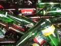 Brown green glass bottles in recycle bin