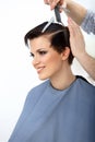 Brown Hair. Hairdresser doing Hairstyle. Beauty Model Woman. Haircut. Royalty Free Stock Photo