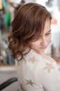 Brown-haired girl in profile with wavy hair Royalty Free Stock Photo