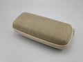 Brown hard shell fabric covering eyeglass case