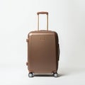 Brown hard-shell suitcase with four wheels, featuring a telescopic handle. The Royalty Free Stock Photo