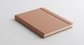 Brown hardcover notebook with a leather-like texture, featuring rounded corners. Royalty Free Stock Photo