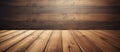 Brown hardwood floor with tree shades on a wooden wall in background Royalty Free Stock Photo