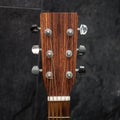 Brown headstock of guitar on a grey background Royalty Free Stock Photo