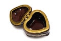 A brown heart shaped jewel box