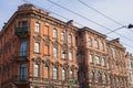 brown historical building of 18th-19th century in St. Petersburg. facade of house on Nevsky Prospekt - 05.29.23
