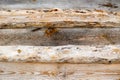 Brown horizontal texture of wooden logs, boards with knots, cracks and beautiful patterns of wood fibers Royalty Free Stock Photo