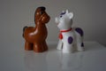 Brown horse and white lamb. Plastic figures. Royalty Free Stock Photo