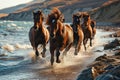 Brown horses running on a beach