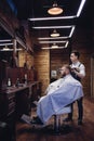 Brown Interior Barbershop with people. Men`s hairdresser