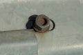 Brown iron rusty nut screwed onto a bolt