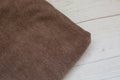 Brown knit fabric on a white background