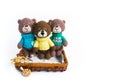 3 brown knited bears on the white background.