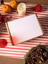 Brown kraft gift mail box with white lid on Christmas table. Craft paper box. Top view. Mockup, closeup, vertical photo Royalty Free Stock Photo