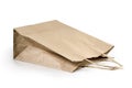 Brown kraft paper bag with copy space on a white background: Clipping path. Royalty Free Stock Photo