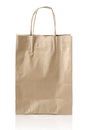 Brown kraft paper bag with copy space on a white background: Clipping path. Royalty Free Stock Photo