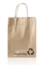 Brown kraft paper bag with copy space on a white background: Clipping path. Royalty Free Stock Photo