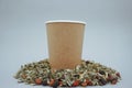 Brown kraft paper cup for hot drinks. Green tea is spilled in the mug Royalty Free Stock Photo