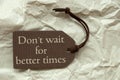 Brown Label With Quote Wait Better Times Paper Royalty Free Stock Photo