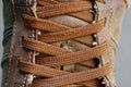 Brown lace-up fabric lacing on boot