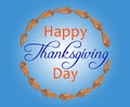 Brown leaf in circle with happy thanksgiving day inside on blue Royalty Free Stock Photo