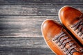 Brown leather boots on wooden background top view with copy space Royalty Free Stock Photo