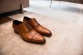 Brown leather classic male shoes on the floor