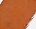 Brown leather coated spiral agenda Royalty Free Stock Photo