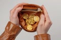 A brown leather coin purse that is filled with golden Bitcoins Royalty Free Stock Photo