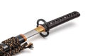 Brown leather cord tie on grip Japanese sword steel fitting and black scabbard. Royalty Free Stock Photo