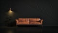 Brown leather couch in a dark room looking stylish.