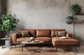 a brown leather couch and a table in a living room Royalty Free Stock Photo