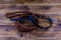 Brown leather dog leash and collar on a wooden background Royalty Free Stock Photo