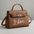 Brown leather handbag featuring a structured design with a top handle and detachable Royalty Free Stock Photo