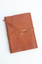 Brown leather journal isolated on light