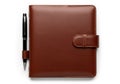 Brown leather journal and pen isolated on white background Royalty Free Stock Photo