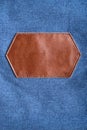 Brown leather label with stitching on denim. Copy space. Mockup Royalty Free Stock Photo