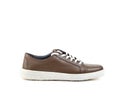 Brown leather men`s sneakers on a white background, side view for a catalog Royalty Free Stock Photo