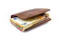 Brown leather mens wallet with a stack of Euro banknotes inside, isolated on a white background, 50 euros visible.