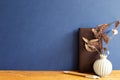 Brown leather notebook, pen, dry flowers on wooden desk Royalty Free Stock Photo