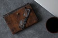 Brown leather notebook, pen, laptop and glasses on gray background Royalty Free Stock Photo