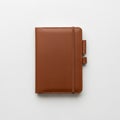 Brown leather notebook with a smooth surface against a white background Royalty Free Stock Photo