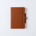 Brown leather notebook with a smooth texture on a white surface Royalty Free Stock Photo
