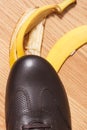 Brown leather shoe before slipping on banana peel Royalty Free Stock Photo