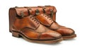 Brown leather shoes and suitcase isolated Royalty Free Stock Photo