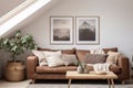 Brown leather sofa with grey pillows and blanket against skylight, Scandinavian home interior design of modern living in attic Royalty Free Stock Photo