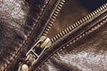 Brown leather texture and metal zipper . Fragment of leather jacket